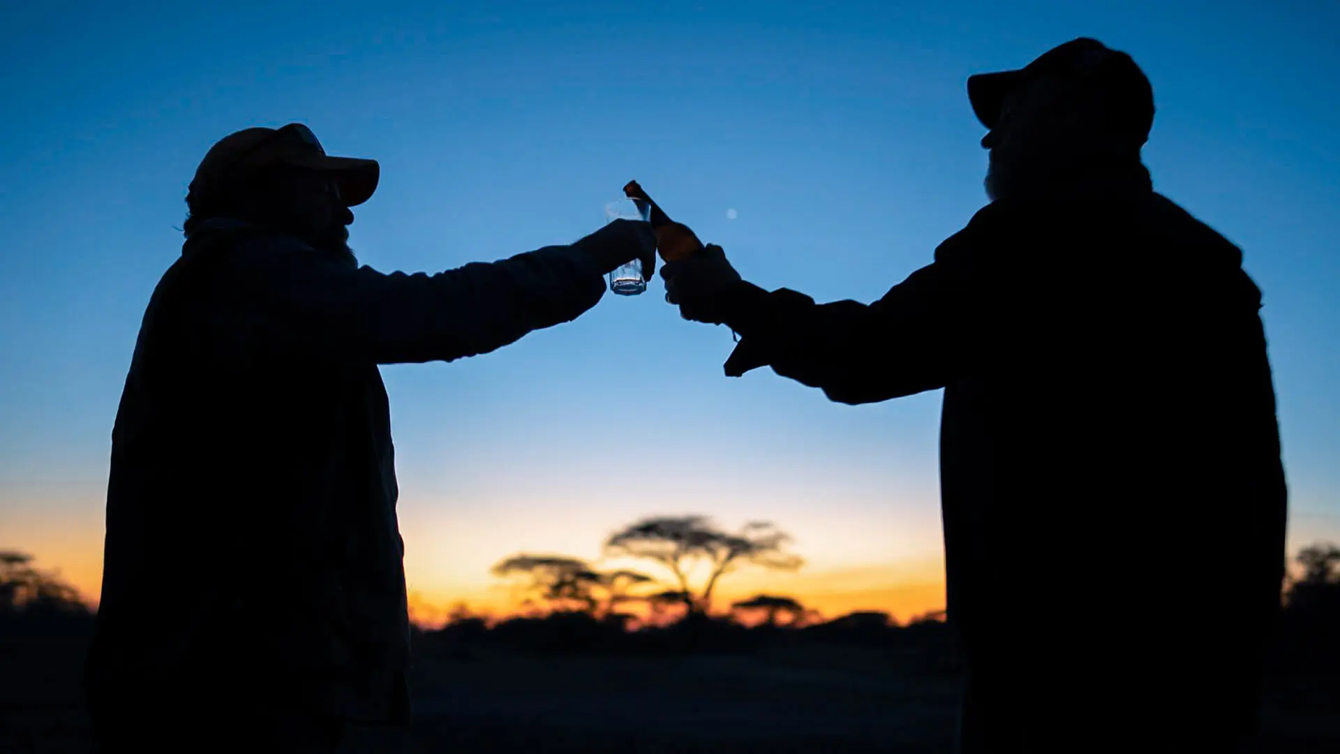 Stopping-for-a-sundowner-before-continuing-on-a-night-game-drive.jpg